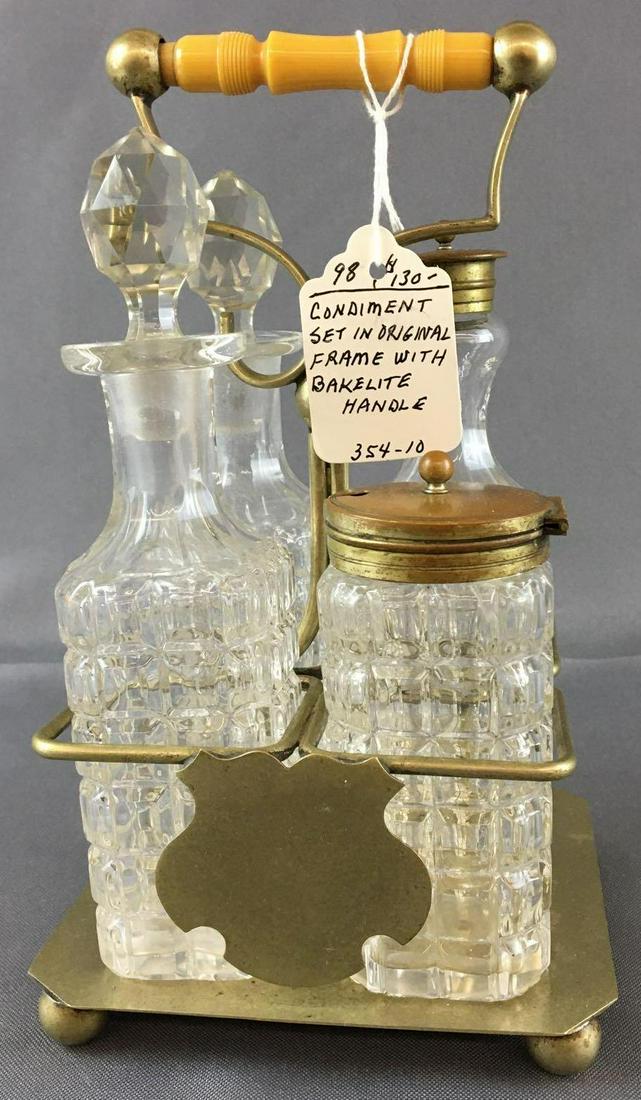 Antique Condiment Set with Bakelite Handle: All original bottles, 8 1/2 inches tall