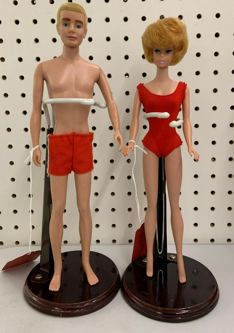 1961 and 1962 Barbie and Ken dolls: Includes 1962 bubble cut Barbie number 850 with earrings, and 1961 Ken number 750 Barbies boyfriend.