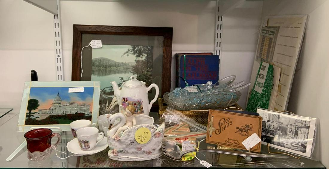 Shelf lot of miscellaneous antique and vintage items: Includes reverse painted glass of the capitol building, childs tea set, and more. Sorry no shipping on this lot.