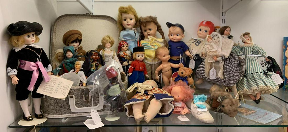 Shelf lot of antique and vintage dolls: Includes princess Diana, strawberry shortcake doll, football player, and more, tallest 15 inches