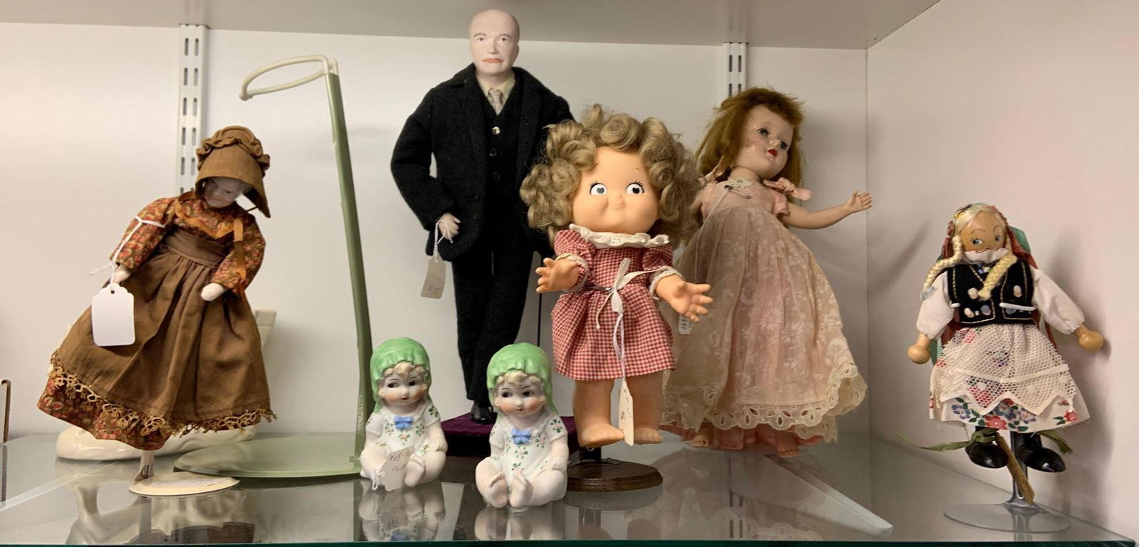 Shelf lot of antique and vintage dolls: Includes Eisenhower, porcelain, rubber, and more, Eisenhower stands 15 inches tall