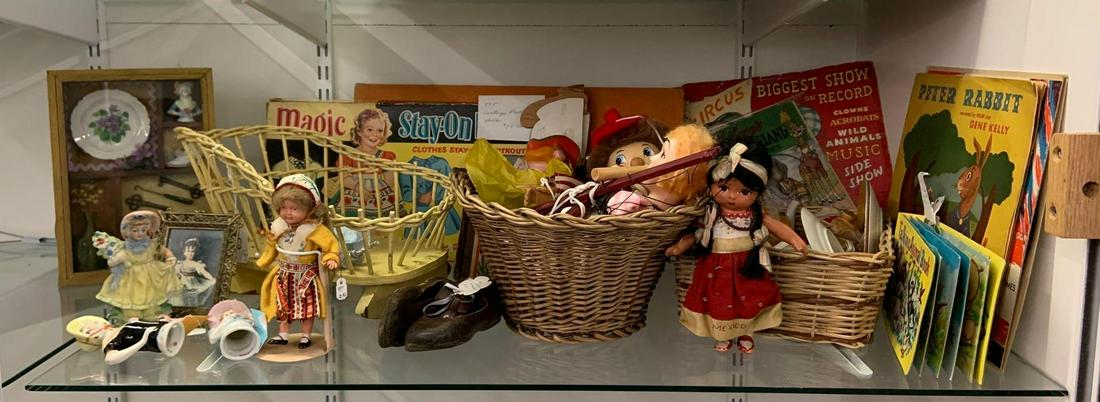 Shelf lot of vintage dolls, doll accessories, and more: Includes books, tea set , dolls, games, and more