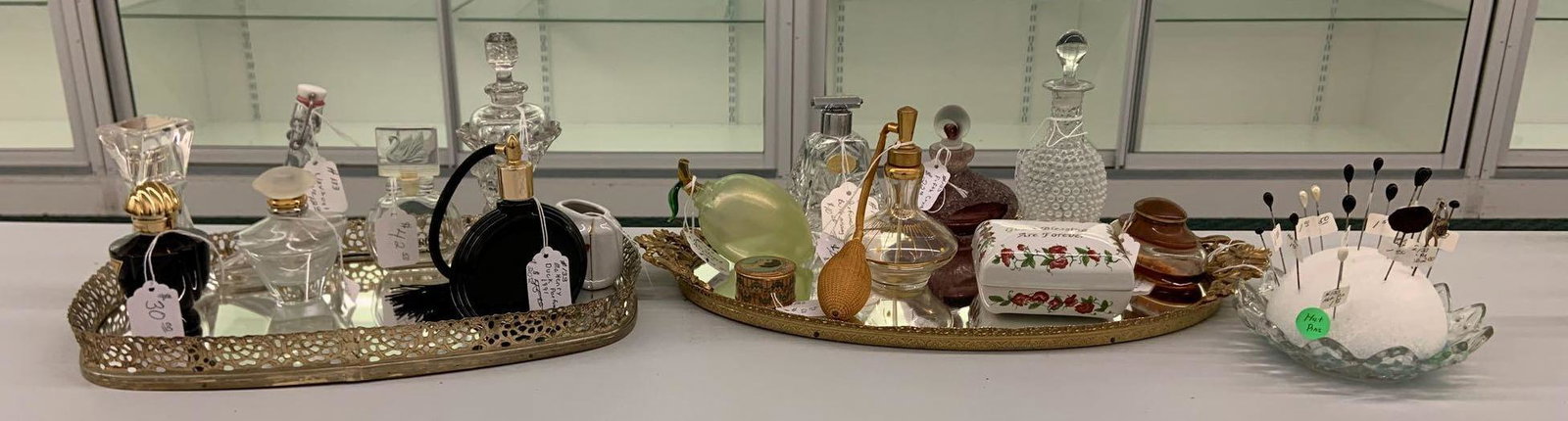 Group of vintage and antique perfume bottles, hat pins,: Tallest bottle stand 6 1/2 inches