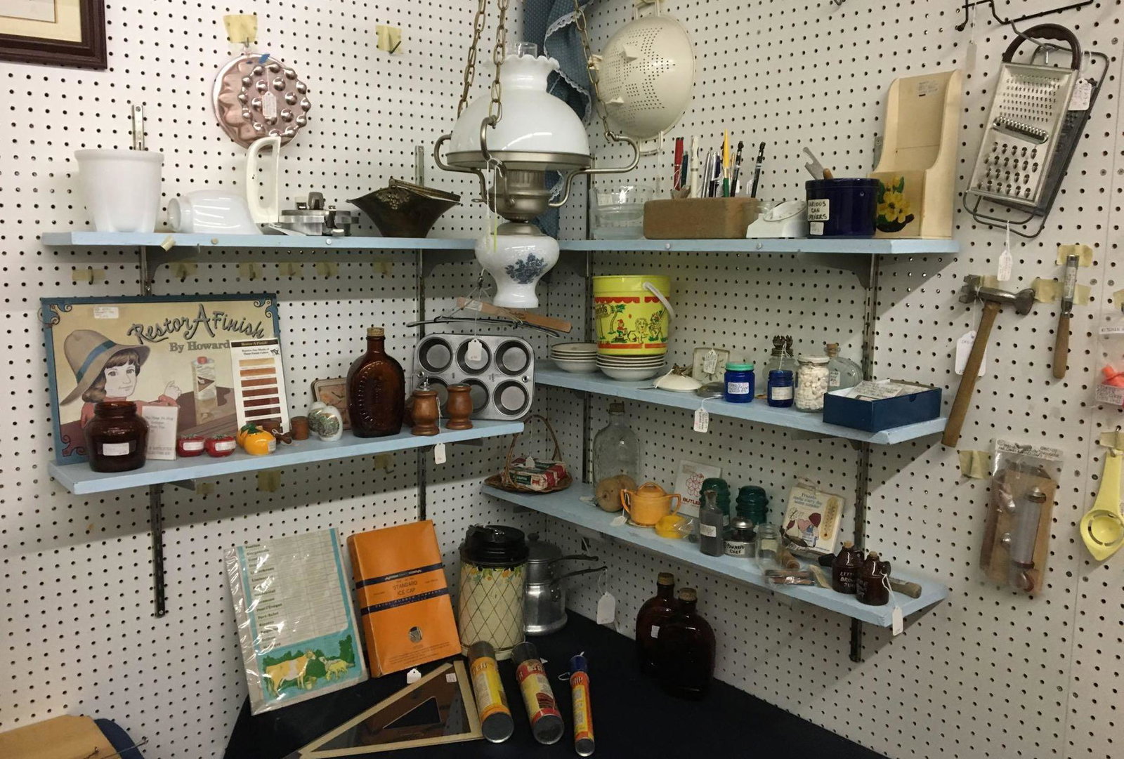 Corner shelf of Antique/Vintage Kitchen Gadgets and: Sorry no shipping on this lot. Includes 35 mm black and white title slides, Metal resor a finish sign, pens, busters in original boxes and more