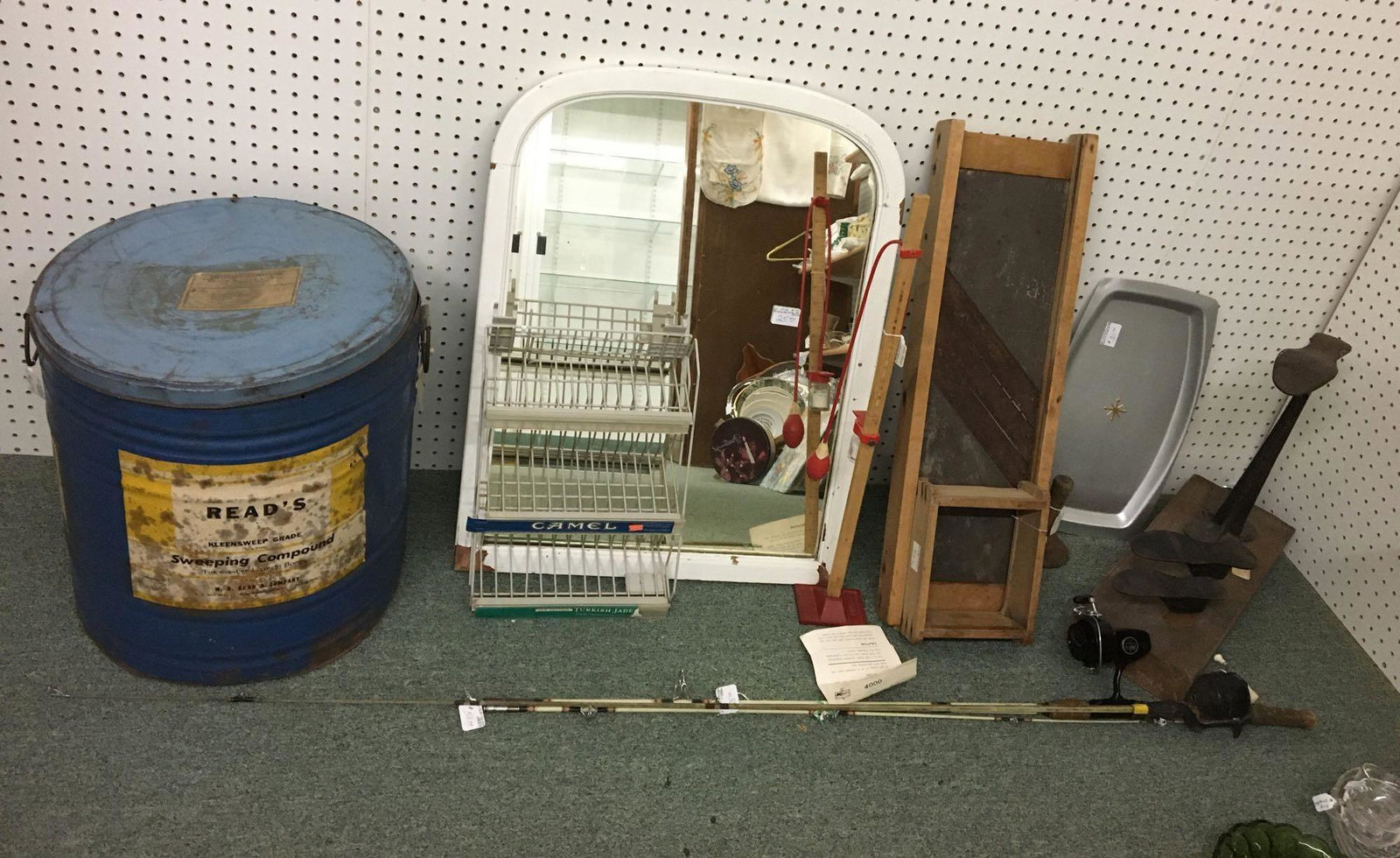 Corner lot of Antique/Vintage Items: Sorry no shipping on this lot. Includes cigarette rack, fishing poles, slaw cutter, round curry comb, mirror and more