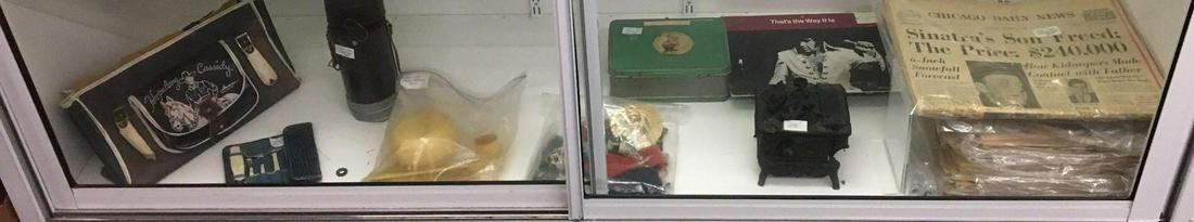 Shelf lot of Antique/Vintage Miscellaneous Items: Sorry no shipping on this lot. Includes cast iron Childs stove, doll accessories, metal lunch box, 300 mm telephoto lens with case, hop along Cassidy bag with damage and more