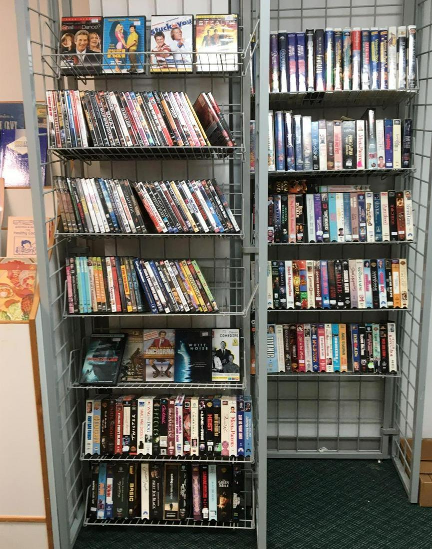 Large group of DVDs and VHS Movies: Includes shallow Hal, walk the line, wild things, white noise, Walt Disney VHS Bambi, the rescuers, Winnie the Pooh and more