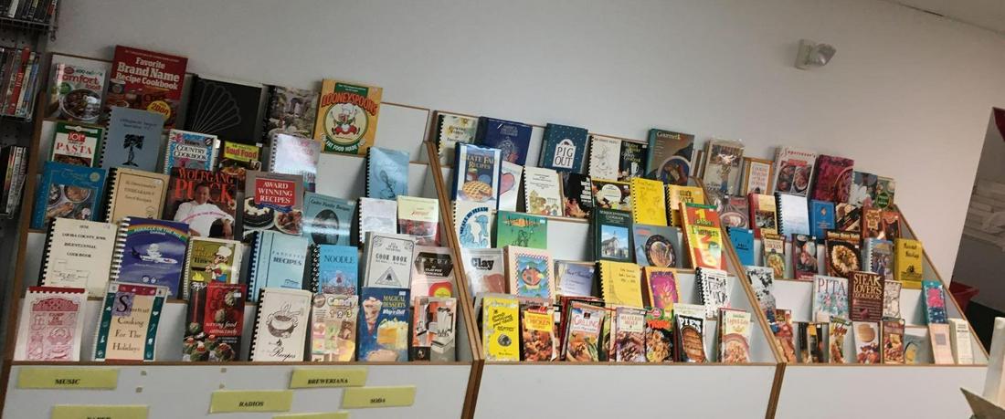 Large group of Vintage Cookbooks and more: Includes wolfgang puck, looneyspoons, state fair recipes, hotter than hell, steak lovers cookbook and more
