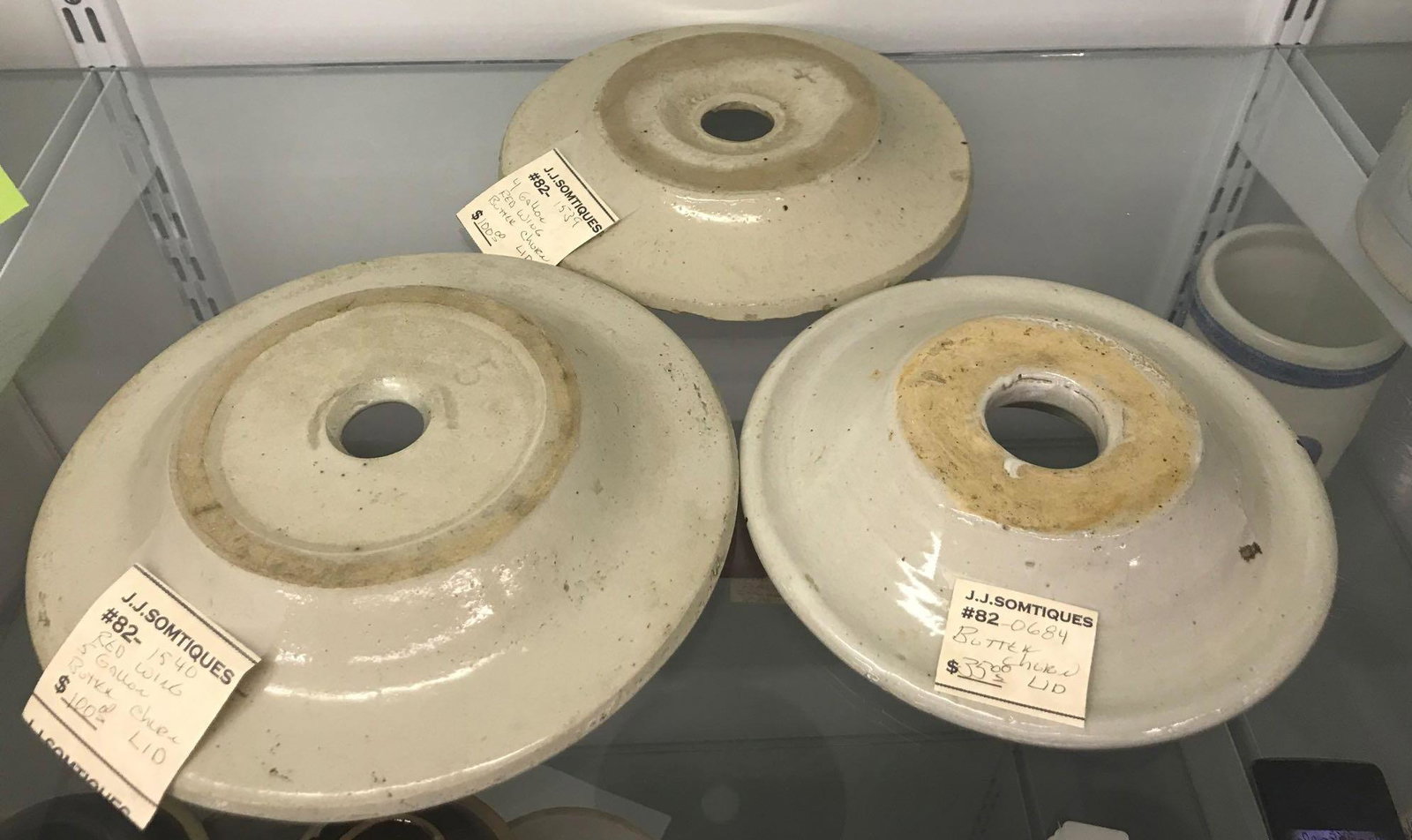 Group of 3 stoneware butter churn lids: Largest is 8.75 inches. (2) Red Wing, other unidentified