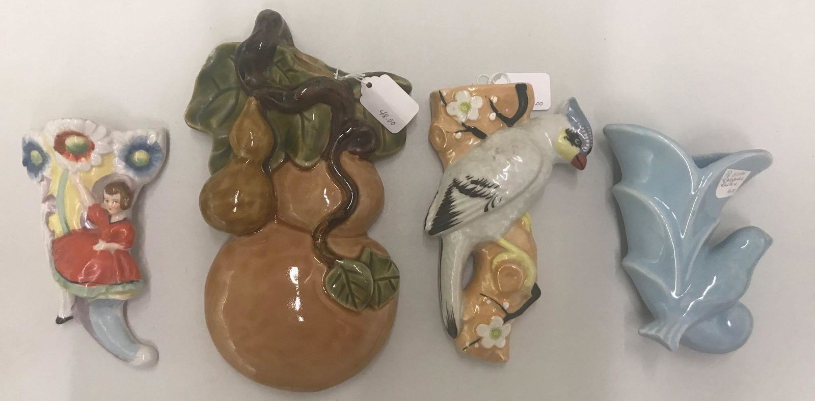 Group of 4 ceramic wall pockets: Largest is 10 inches