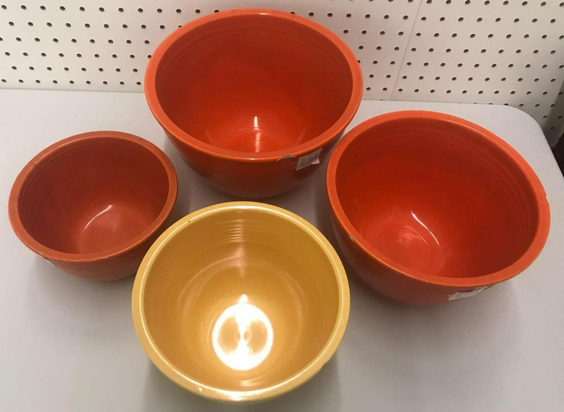 Group of 4 vintage Fiesta Ware nesting bowls: Largest is 9.75x6.5 inches. Chips and cracks throughout
