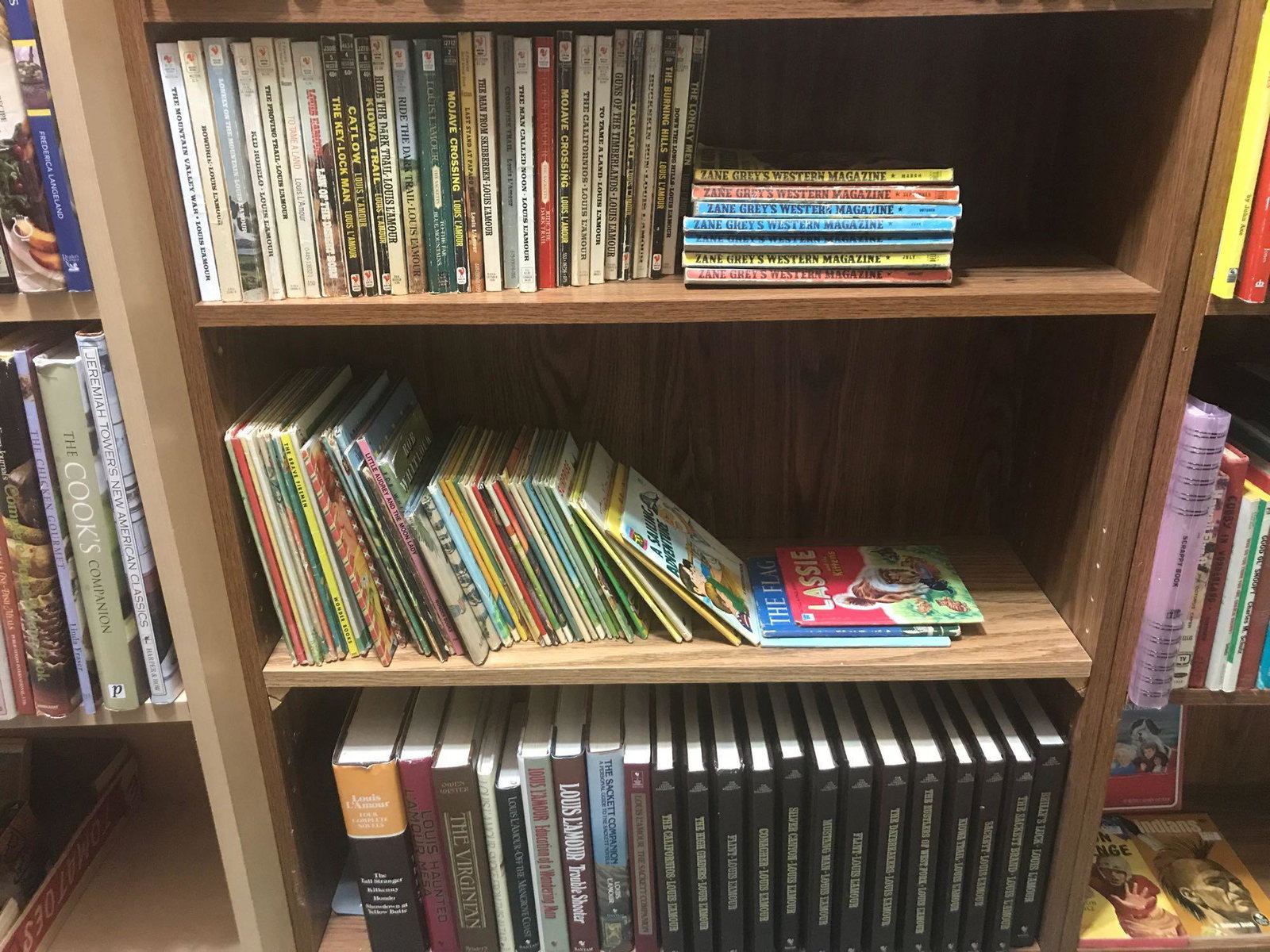 Shelf lot-3 shelves of childrens books and vintage: Includes Lassie, Zane Greys Western Magazine, many Louis Lamour books and more