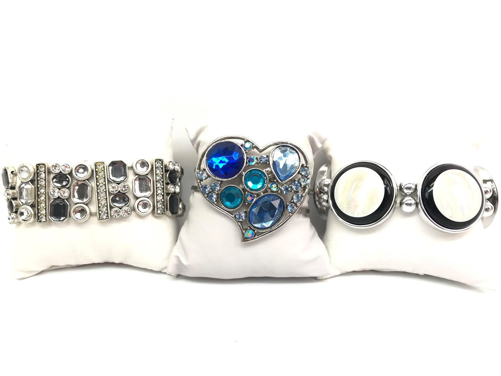 Bold Statement Bracelet Collection: Lot consists of three bold fashion bracelets. Silver tone and faceted gray bead stretch bracelet retains its original "lia sophia" hang tag; silver black and gray stretch bracelet presents a polished 