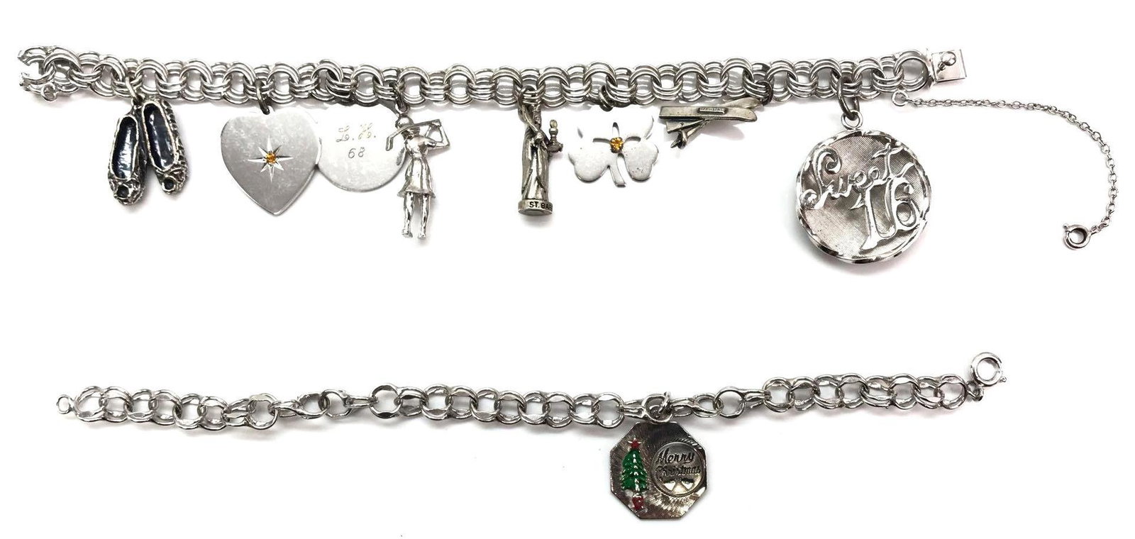 Lot of 2: Sterling Silver Charm Bracelets - Christmas: Sterling silver 7-1/2 inch triple link charm bracelet features eight sterling charms. The lot's 7 inch sterling silver bracelet features a double link chain and sterling "Merry Christmas" charm. 53.5g
