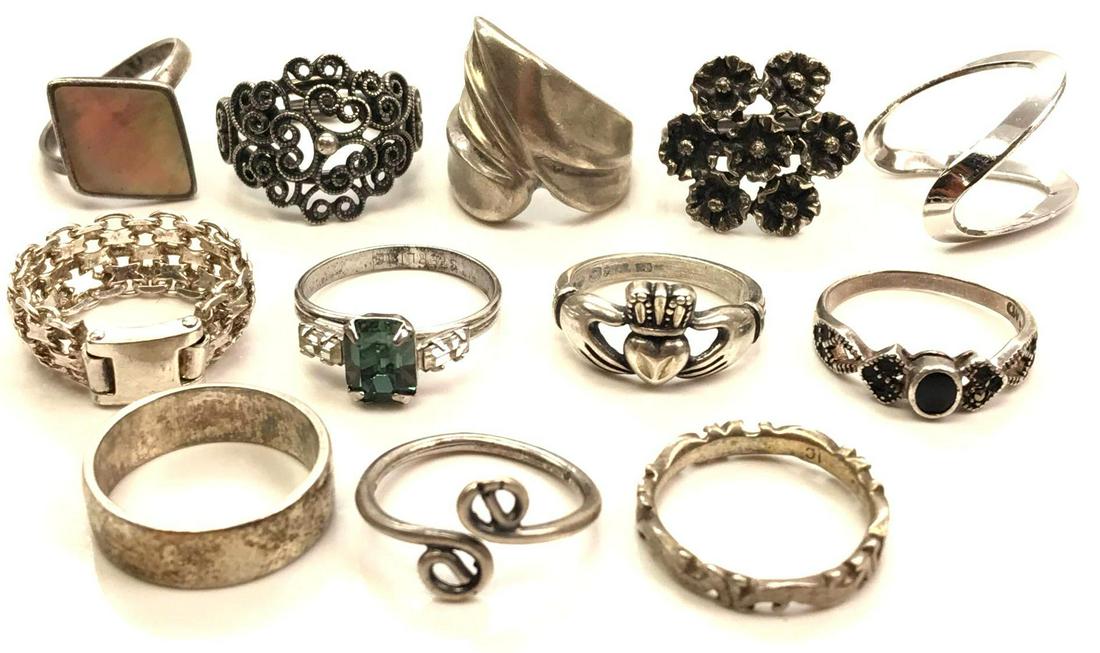 Lot of 12 Sterling Silver Rings: Size 5 - Abalone,: Sterling silver size 5 ring collection features attractive bands, adjustable styles, abalone, claddagh, and more; 36.0g