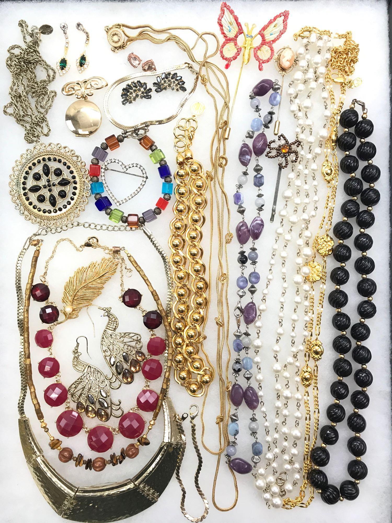 Vintage Costume Jewelry Wardrobe: A beautifully complete costume collection featuring a stylish "knotted" rope chain necklace, bold bead necklaces, colorful multi-stone bracelets, and much more.