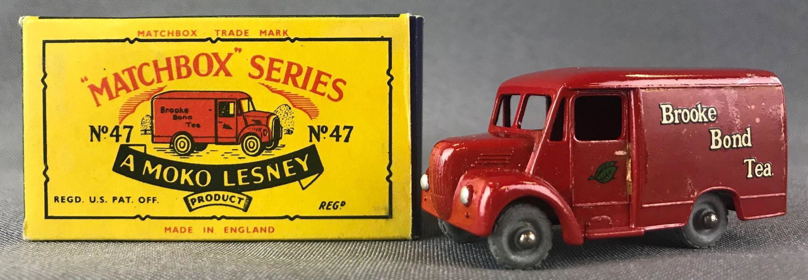 Matchbox No. 47 Trojan Die-Cast Vehicle with Original: 1 Ton Trojan Van. Red body, metal wheels, tea leaf and Brooke Bond Tea decals. A Moko Lesney Product. Made in England, B Box