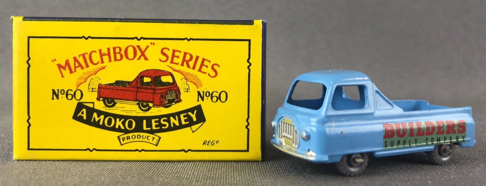 Matchbox No. 60 Morris Omnitruck Die-Cast Vehicle with: Light blue body, GPW, Builders Supply Company decals. A Moko Lesney Product. Made in England, B Box