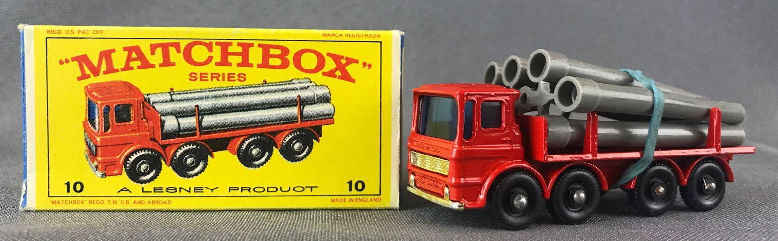 Matchbox No. 10 Pipe Truck Die-Cast Vehicle with: Red body, blue windows, BPW. A Lesney Product. Made in England