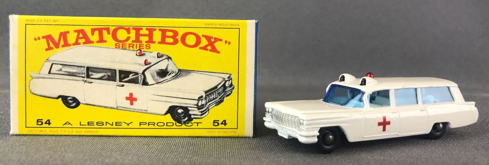 Matchbox No.54 Cadillac Ambulance Die-Cast Vehicle with: White body, blue windows, BPW, red cross decals. A Lesney Product. Made in England, E Box