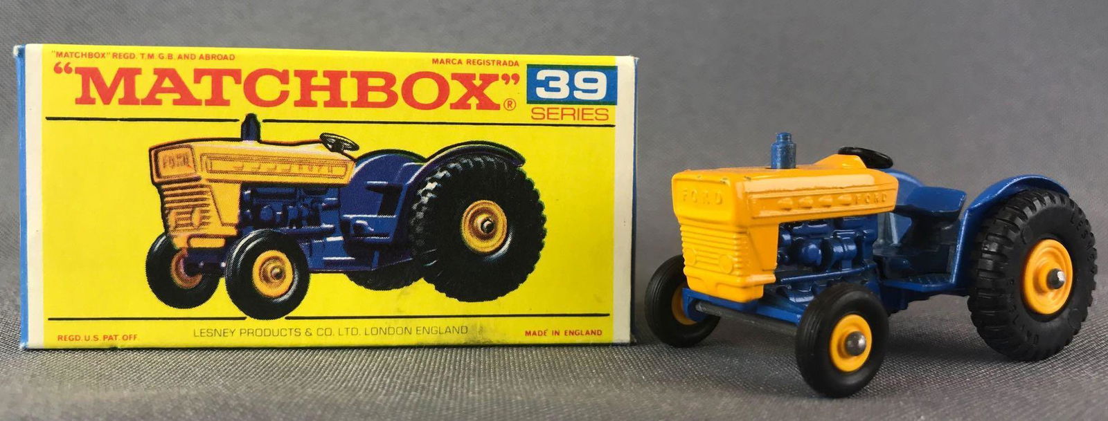 Matchbox No. 39 Ford Tractor Die-Cast Vehicle with: Yellow/blue body, BPW. A Lesney Product. Made in England, F Box