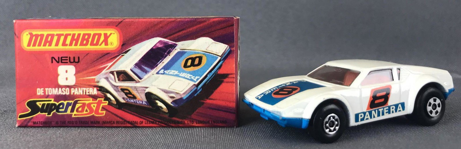 Matchbox Superfast No. 8 DeTomaso Panthers Die-Cast: White body, blue base, BPW, blue/orange/black/white Pantera/8 decals. A Lesney Product.ÊJ Box