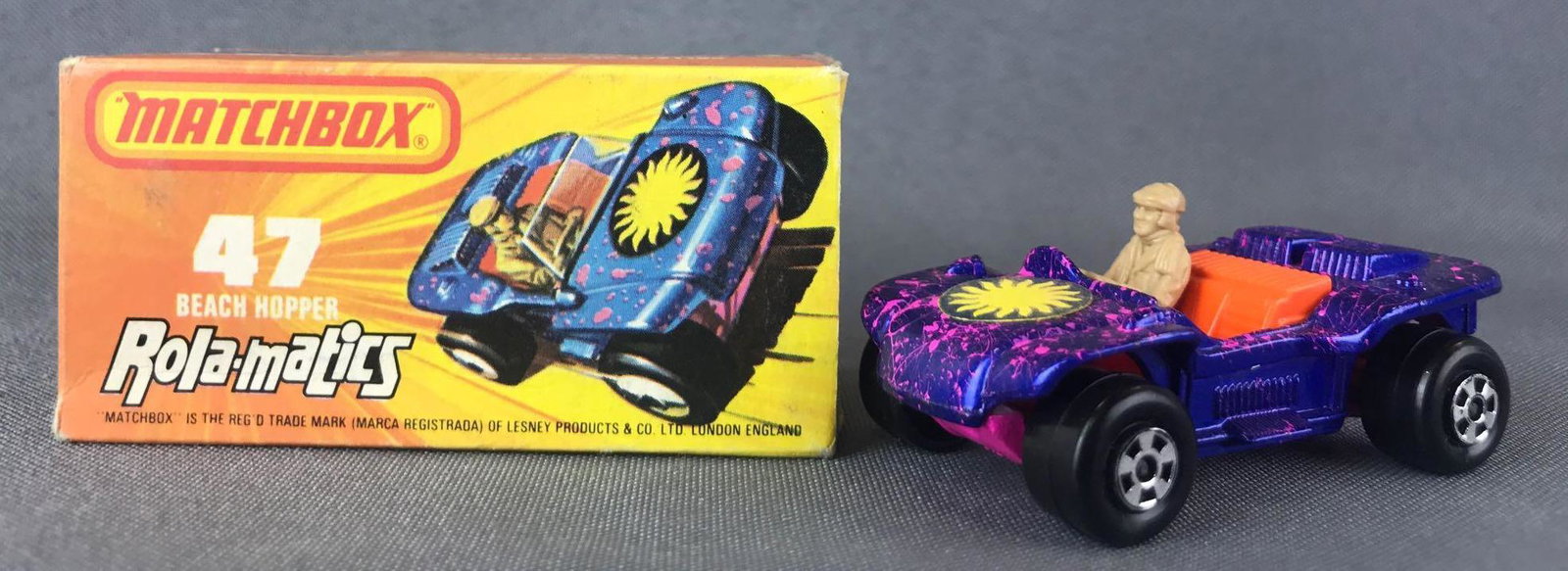 Matchbox Rola-matics Superfast No. 47 Beach Hopper: Blue/pink splatter body, pink base, BPW, black/yellow sun decal. A Lesney Product.ÊJ Box