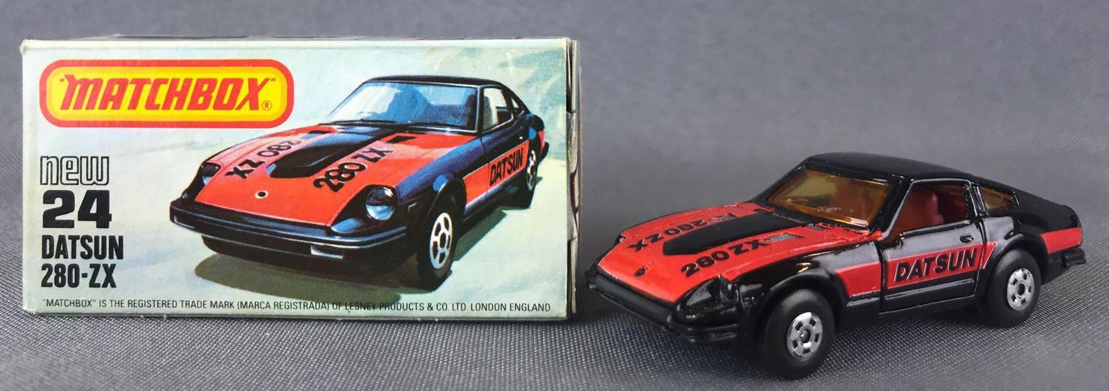 Matchbox No. 24 Datsun 280-ZX Die-Cast Vehicle with: Red/black body, amber windows, BPW. Some box damage. A Lesney Product.Ê, L Box