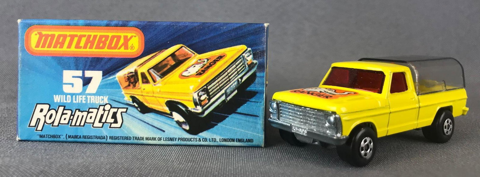 Matchbox Rola-matics Superfast No. 57 Wild Life Truck: Yellow body, red windows, BPW, orange/white Ranger/elephant decal. A Lesney Product.ÊJ Box