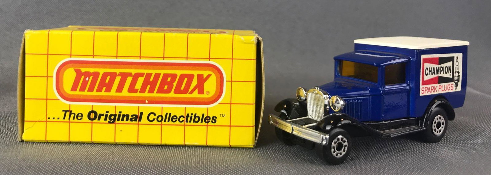 Matchbox Superfast No. 68 Model A Ford Die-Cast Vehicle: Blue body, amber windows, BPW, Champion Spark Plugs decals. A Lesney Product. Made in England