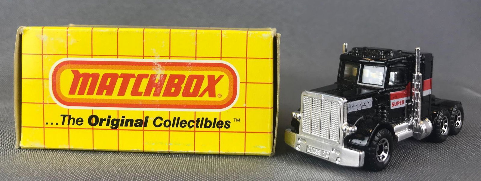 Matchbox No. 43 Peterbilt Die-Cast Vehicle with: Black body, BPW, red/white stripes/Super. A Lesney Product. Made in England