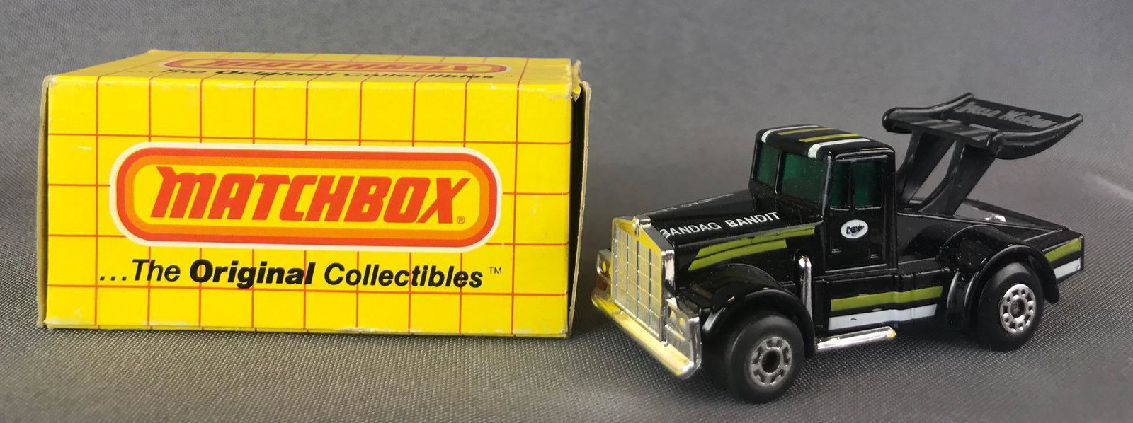 Matchbox No. 65 Kenworth Die-Cast Vehicle with Original: Black body, green/white stripes/Badang Bandit, silver stripes/Tyrone Malone, BPW. A Lesney Product. Made in England