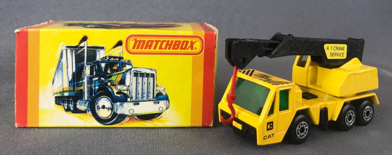 Matchbox Superfast No. 49 Crane Truck Die-Cast Vehicle: Yellow body, green windows, BPW. Cat, Safety First, A-1 Crane Service decals. A Lesney Product. Made in England