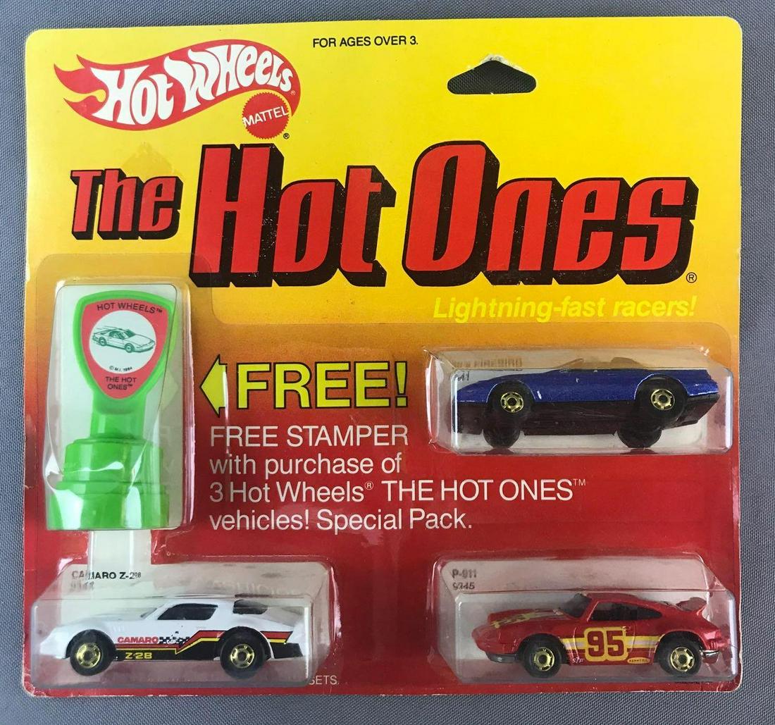 Hot Wheels The Hot Ones 3-Pack Die-Cast Vehicles in: Includes No. 9341 80s Firebird, 9345 P-911, 9344 Camaro Z-28, and bonus stamper