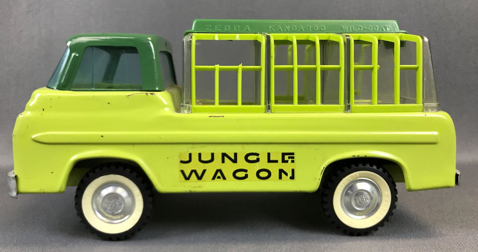 Nylint Pressed Steel Jungle Wagon Ford Econoline: Pressed steel 11 x 6 inches some scratches cages lift up some have broken pieces shown in pictures with random animals