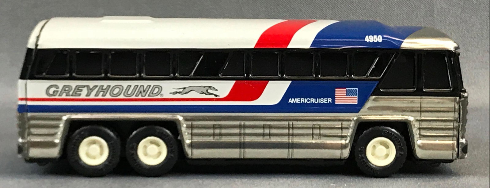 Buddy L Greyhound Bus: Japanese tin Americruiser number 4950 some scratches 7 1/2 x 2 1/2 inches