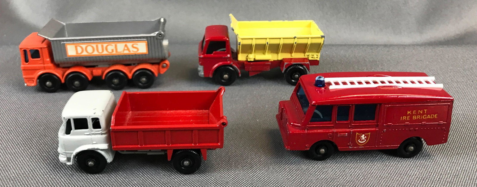 Group of 4 Matchbox Diecast Vehicles: Used, Includes No. 57,3,51,70. Douglas Grit Spreading Truck 8 Wheel Tipper Bedford 7 3/4 Ton Tipper Land Rover Kent Fire truck