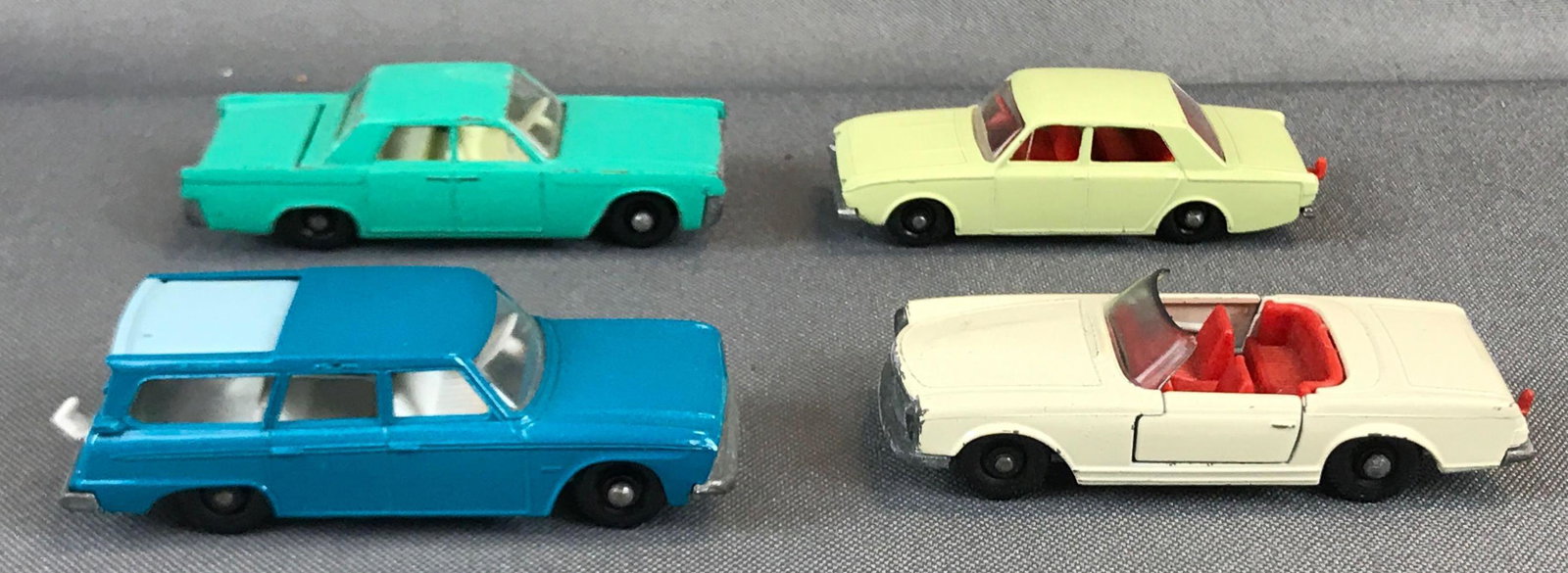 Group of 4 Matchbox Diecast Vehicles: Used, Includes No. 31,27,45,42. Studebaker Lark Wagonaire with sliding roof broken hitch Lincoln Continental Mercedes 230 SL Ford Corsair som with opening doors trunks