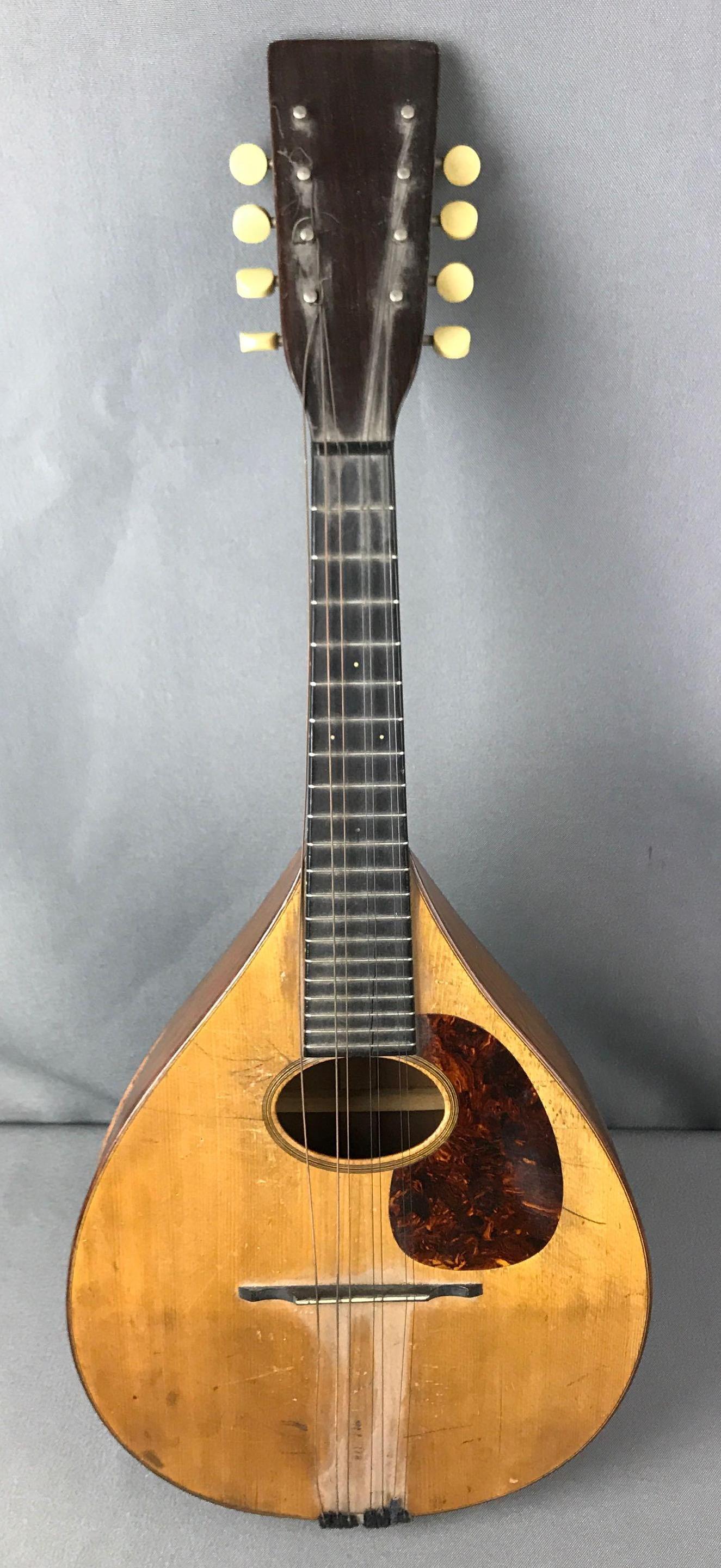 Antique 1905 C.F. Martin & Co. Mandolin: Needs repairs. Some wear and scratches from use and age. Measures 24 x 9 1/2 x 2 3/4 inches, serial number 10992, C.F. Martin & Co. Nazareth, PA. marked on the inside of mandolin, marked Wurlitzer on 