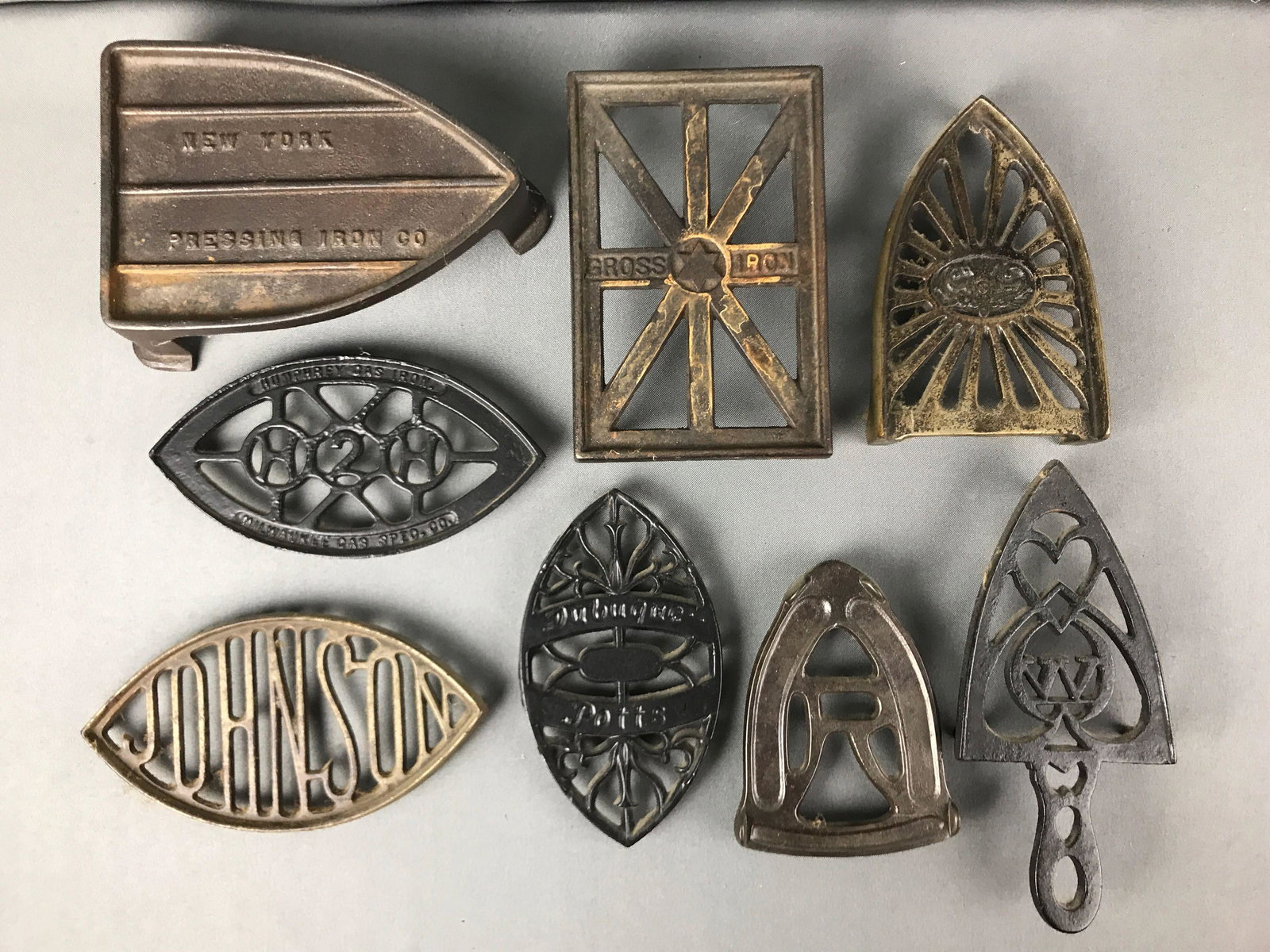 Group of 8 : Antique Cast Iron Trivets for Sad Irons: Longest is 9 inches
