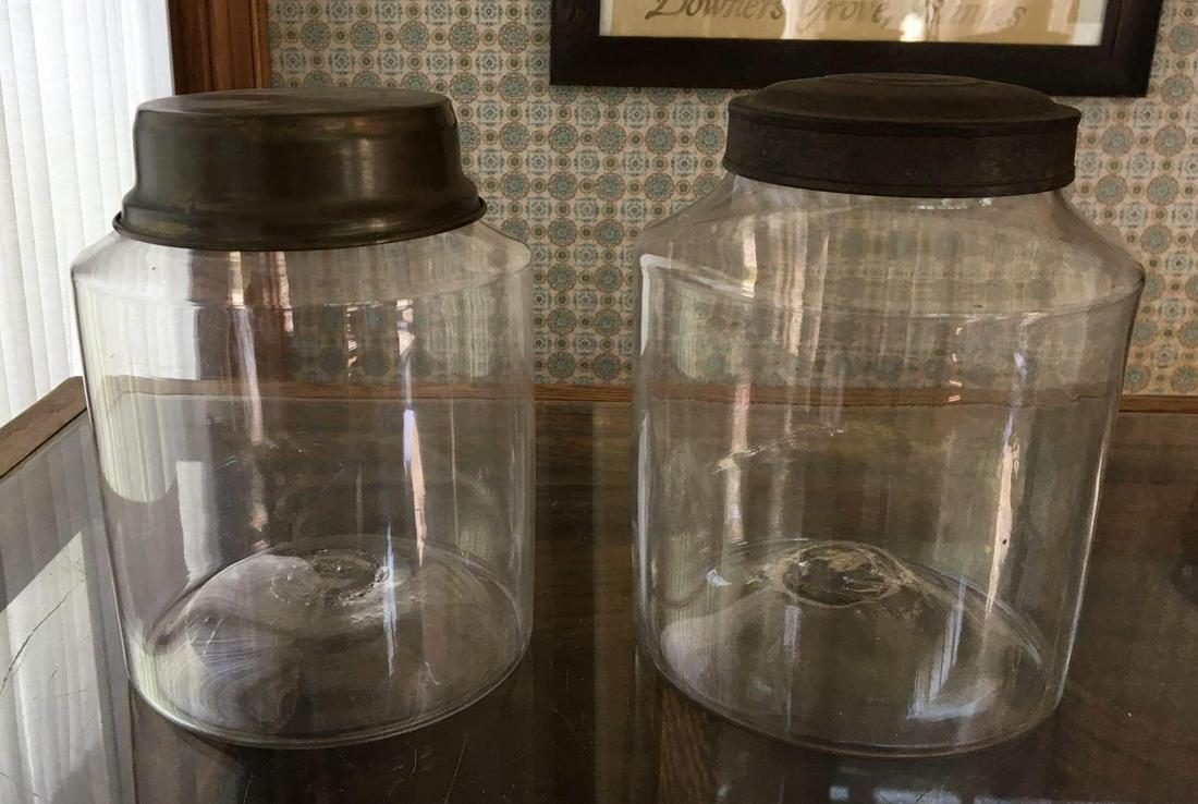 Group of 2 : Antique Clear Glass Pantry Jars: Metal lids, larger is 7 1/2 inches tall