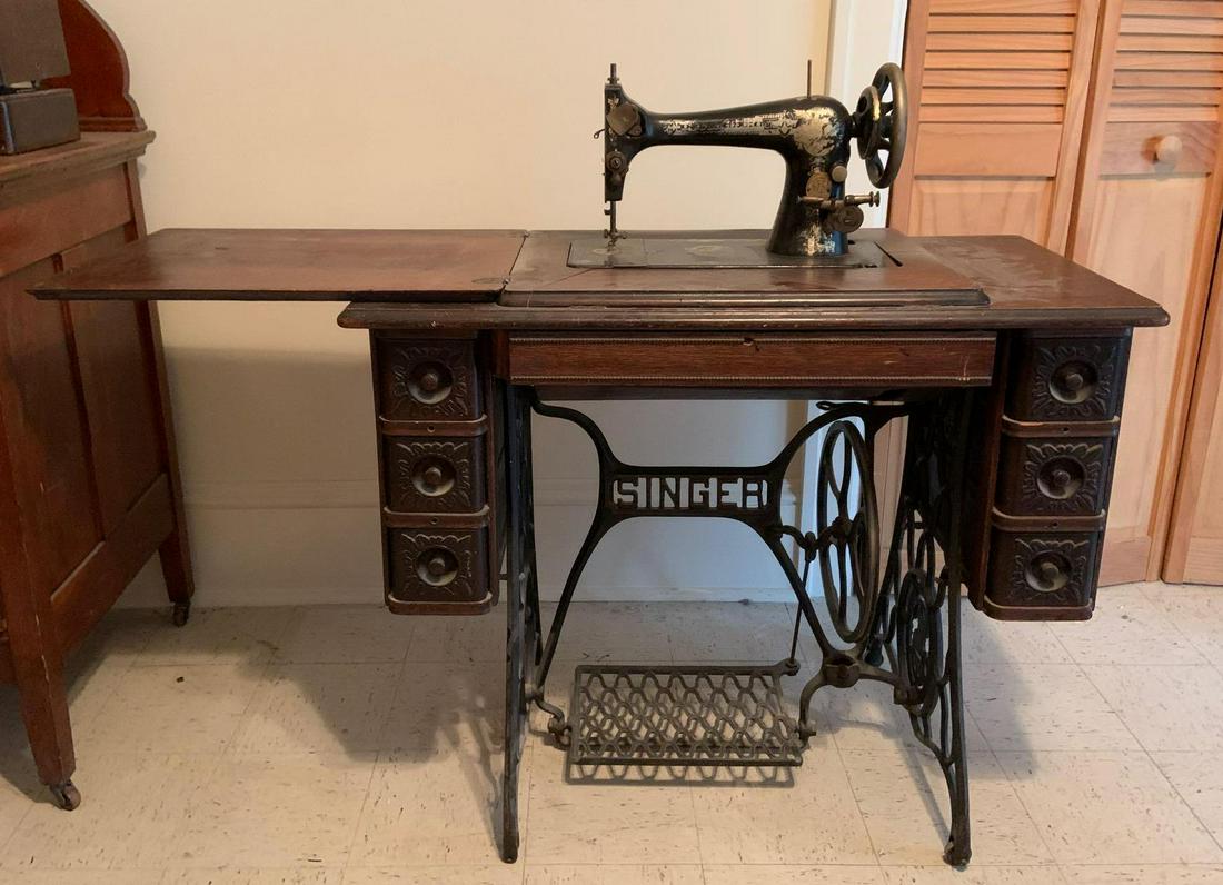 Antique Singer Sewing Machine Cabinet: 36 x 18 x 31 inches; some finish issues.Shipping is not available for this lot. Pick up only. (Large or heavy items can be transferred to our Gallery for an additional fee.)