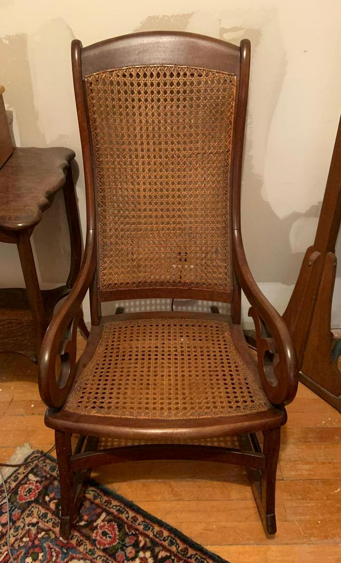 Antique Rocking Chair w/ Caned Seat and Back: 42 x 21 x 32 inches.Shipping is not available for this lot. Pick up only. (Large or heavy items can be transferred to our Gallery for an additional fee.)