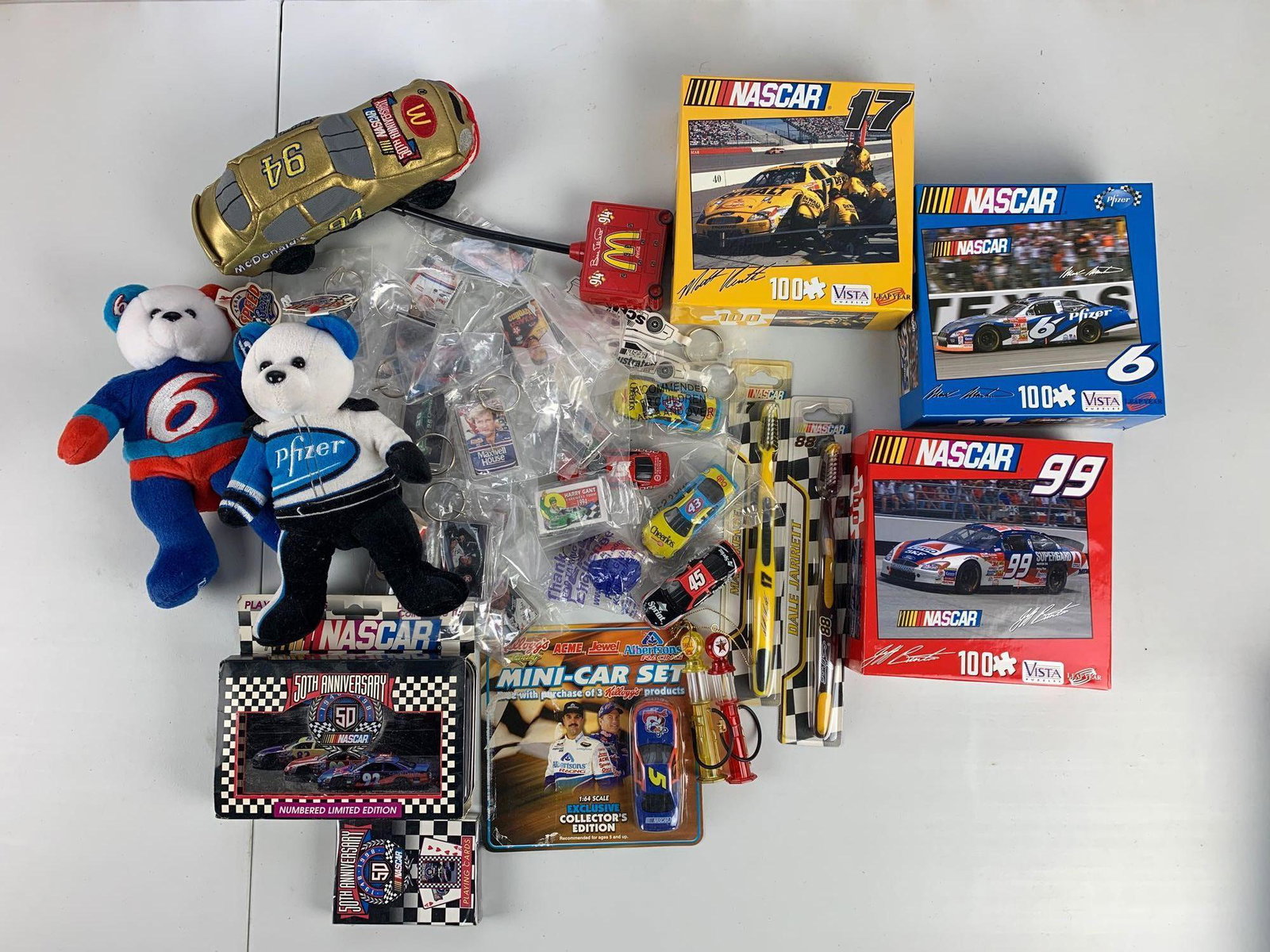 Group of 20+ : NASCAR Items: Premium diecast toothbrush, key rings, plush toys, puzzles, and more