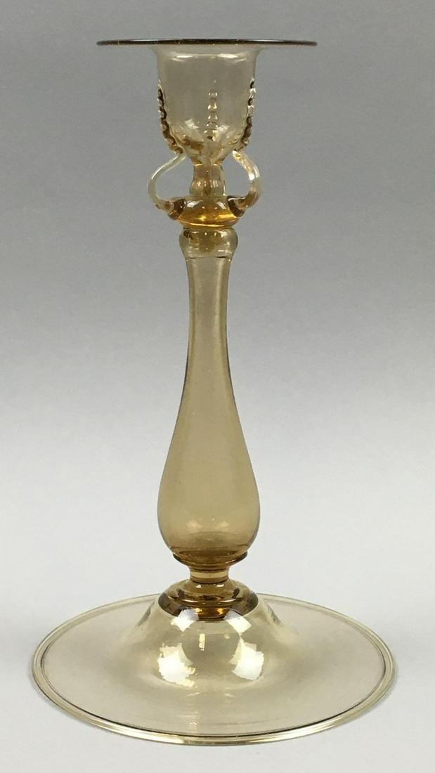Steuben Topaz Candlestick: This Steuben Topaz Candlestick measures 9-1/2 x 7-1/2 inches at its base with a 3 inch top diameter; and is in excellent condition with no chips or flaw