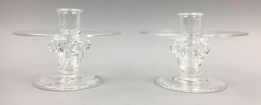 Pair of Steuben Clear Crystal Candlesticks designed by: This handsome pair of Clear Crystal Candlesticks (McNaughton design #7808) measure 3-3/4 x 5-1/4 inches. Both candlesticks are signed on the bottom with the script Steuben etched signature. The candle