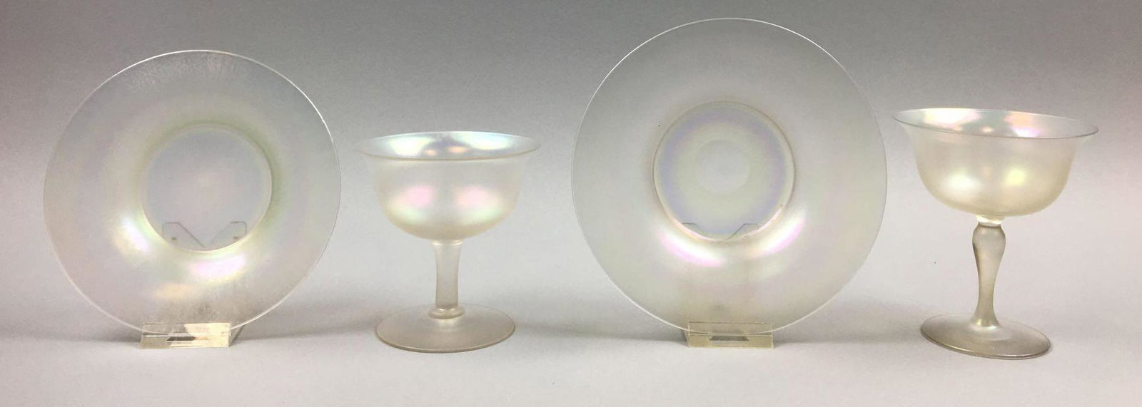 Steuben Collection"Verre de Soie" : Sherbets and: With exceptional iridescence this collection of Steuben "Verre de Soie" is truly eye-catching. This lot consists of two Underplates (6 and 5-1/2 inches); and two Sherbet Dishes (4-1/2 and 3-3/4 inches