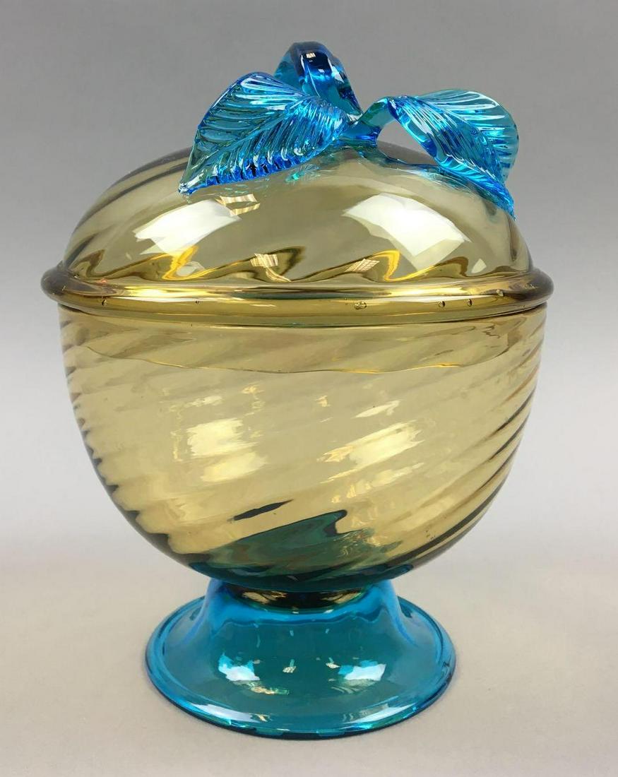 Stevens & Williams Art Glass Covered Bowl: With an attractive Amber Swirl and applied blue leaves, this Stevens & Williams Covered Bowl measures 7 x 5 inches and is in very good condition, without chips of flaws