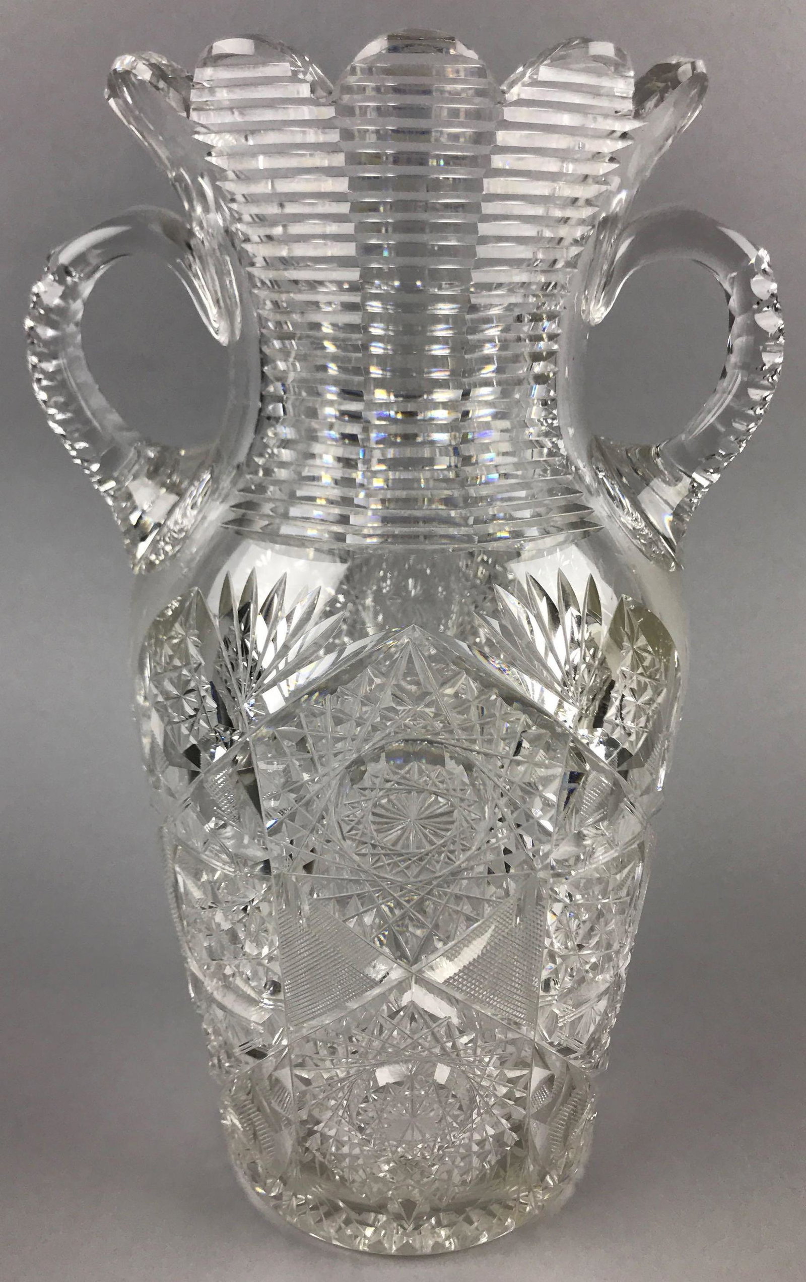 American Brilliant Period Cut Glass Celery Vase: 12 inches tall. Crosshatch, star, hobstar patterns; some minor chips and wear consistent with age and use