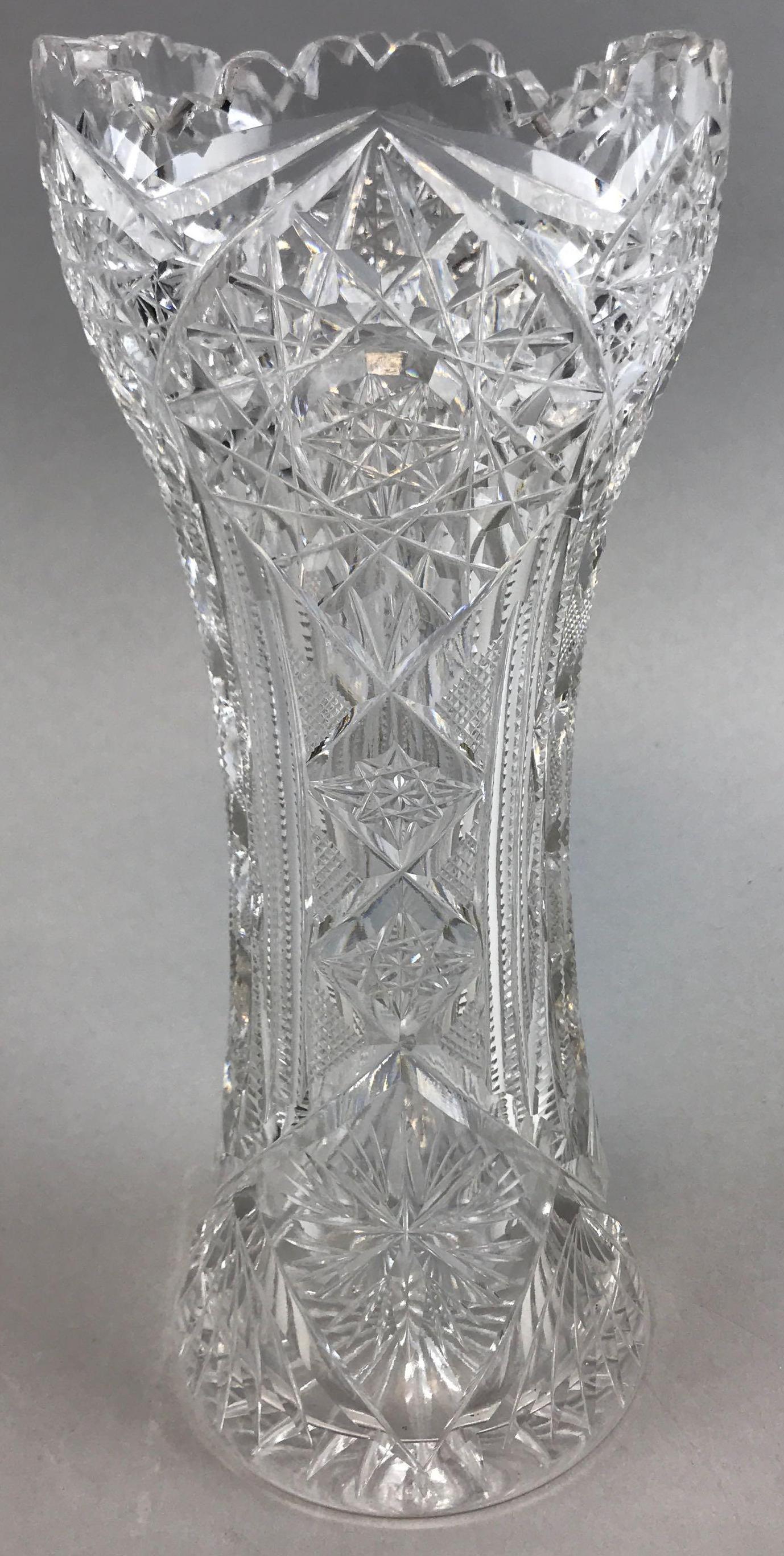 American Brilliant Period Star Pattern Cut Glass Vase: 10 inches tall. Prism cut star pattern; very attractive antique condition with minor base wear and flea bite chips